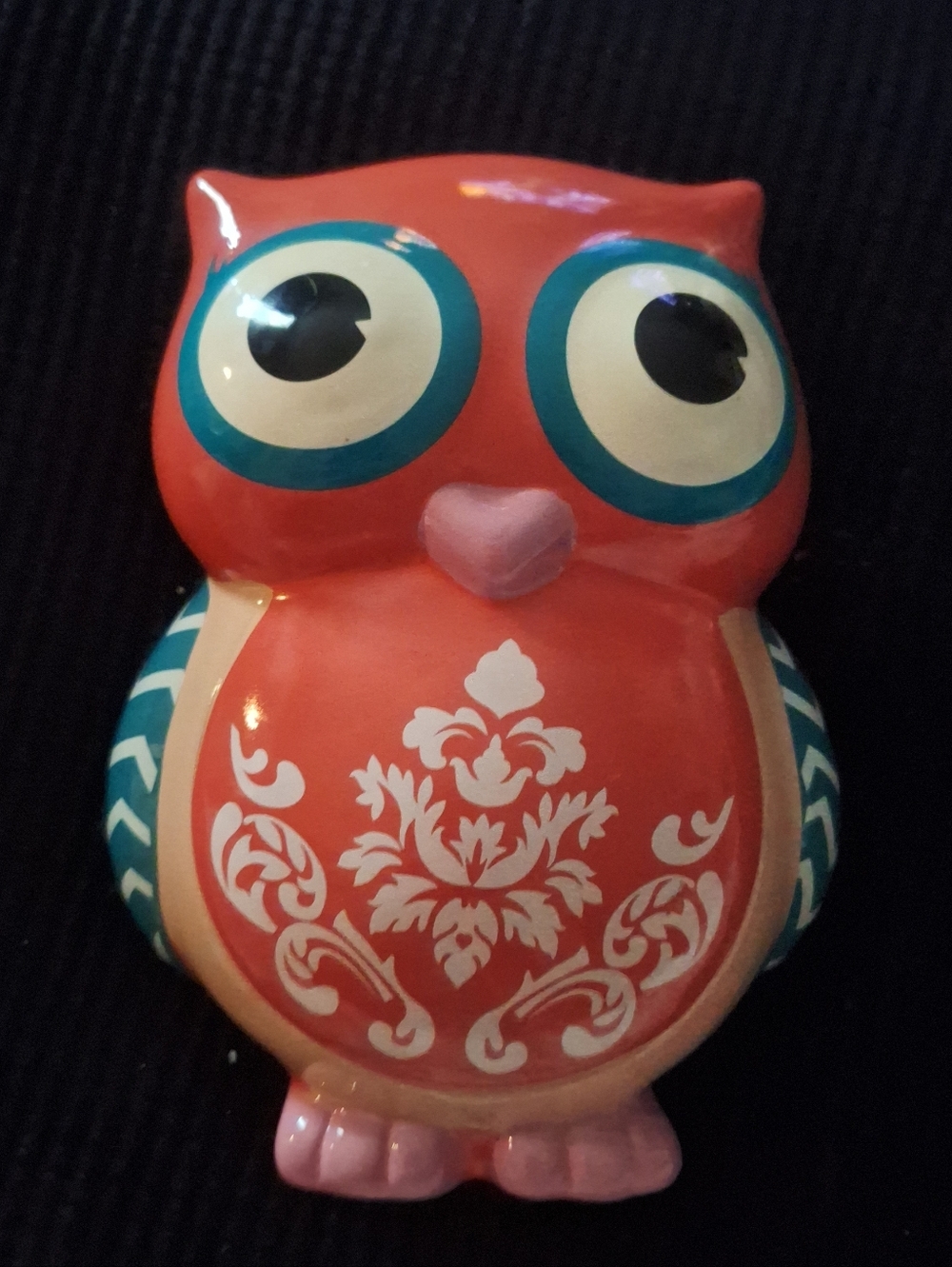 The Peach Owl Coin Bank is an original glass coin bank featuring an owl design